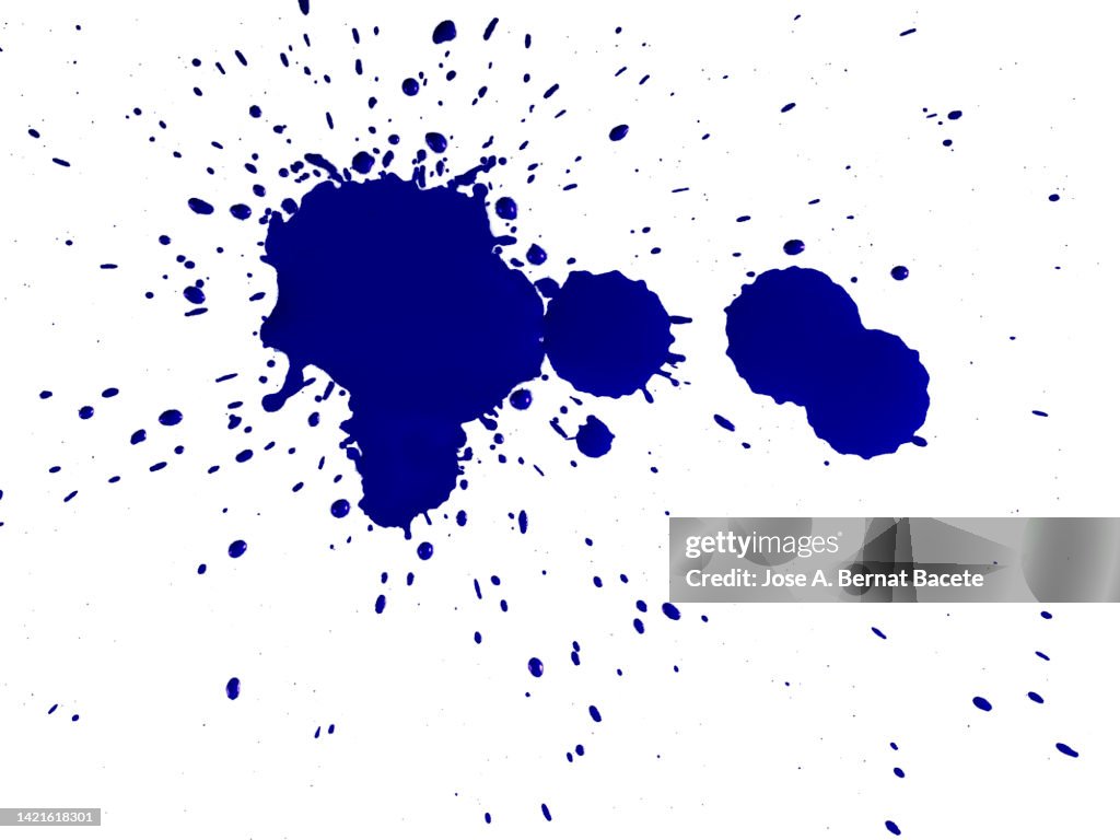 Splashes from a drop of lilac acrylic paint on a white background.