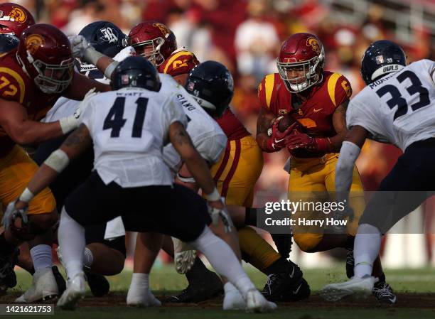 Austin Jones of the USC Trojans carries the ball during a 66-14 Trojans win over the Rice Owls at United Airlines Field at the Los Angeles Memorial...