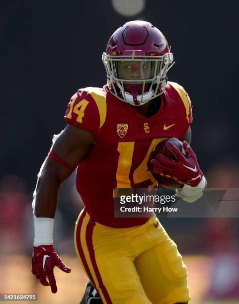 Raleek Brown of the USC Trojans carries the ball during a 66-14 Trojans win over the Rice Owls at United Airlines Field at the Los Angeles Memorial...