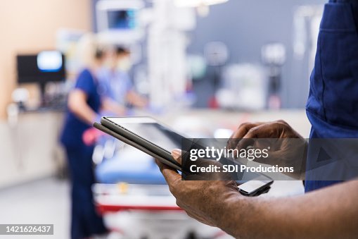 Unrecognizeable person using digital tablet Unrecognizeable person using digital tablet