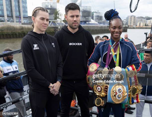 Savannah Marshall and Claressa Shields pose for a photo with Boxxer promoter Ben Shalom during a Boxxer media workout on a boat on the River Thames...