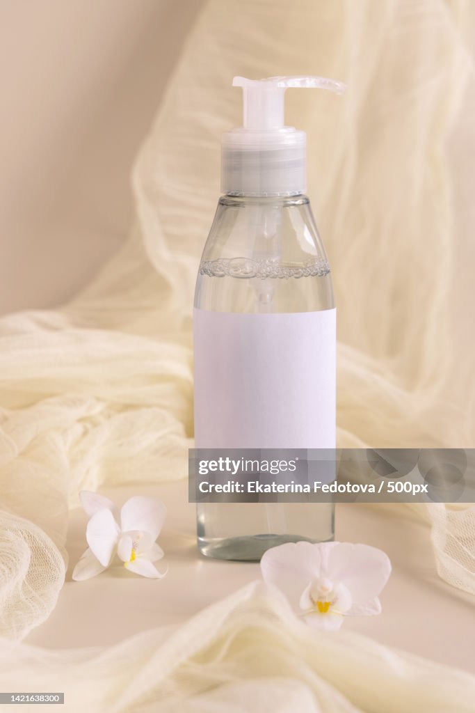 Close-up of milk bottles with milk bottle and towel on bed