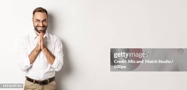 sly and satisfied man having an idea,rubbing hands and scheming - rubbing hands together stock pictures, royalty-free photos & images