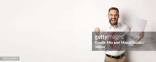 successful manager making fist pump,rejoicing of work and showing - formal shirt stock pictures, royalty-free photos & images