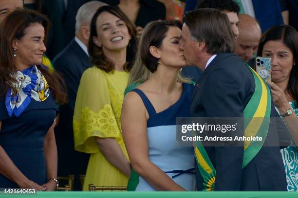 President of Brazil Jair Bolsonaro kisses his wife Michelle Bolsonaro during a parade to celebrate Brazil's 200 Independence anniversary on September...