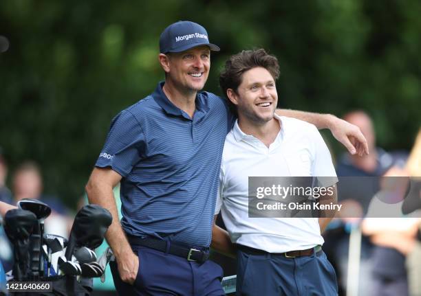 Justin Rose of England embraces Niall Horan on the 2nd tee during the BMW PGA Championship Pro-Am at Wentworth Golf Club on September 07, 2022 in...