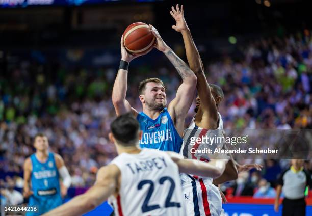 Luka Doncic of Slovenia in action against Timothe Luwawu-Cabarrot of France during the FIBA EuroBasket 2022 group B match between France and Slovenia...