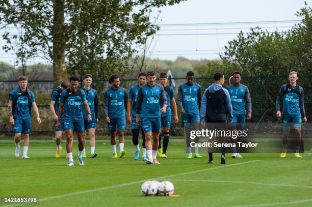 Players walk outside to warm up with Newcastle United's Sports Scientist Dan Hodges during the Newcastle United Training Session at the Newcastle...