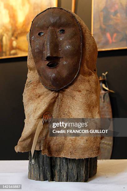 Picture taken on March 31, 2012 in Paris shows an executioner mask on display during the "Peines et chatiments d'autrefois" exhibition at the Fernand...