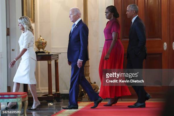 First Lady Jill Biden and U.S. President Joe Biden arrive with former First Lady Michelle Obama and former President Barack Obama at a ceremony to...