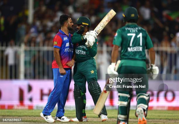 Farid Ahmad Malik of Afghanistan exchange words with Asif Ali of Pakistan after dismissing him during the DP World Asia Cup match between Afghanistan...