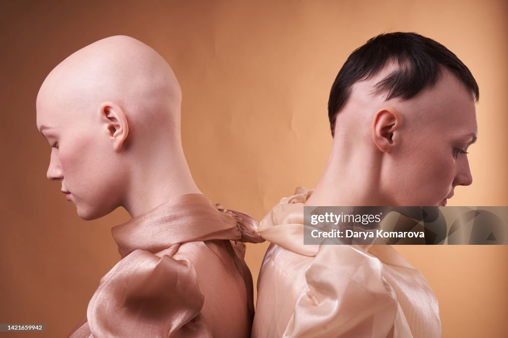 Two women connected by the same problem, different stages of alopecia.