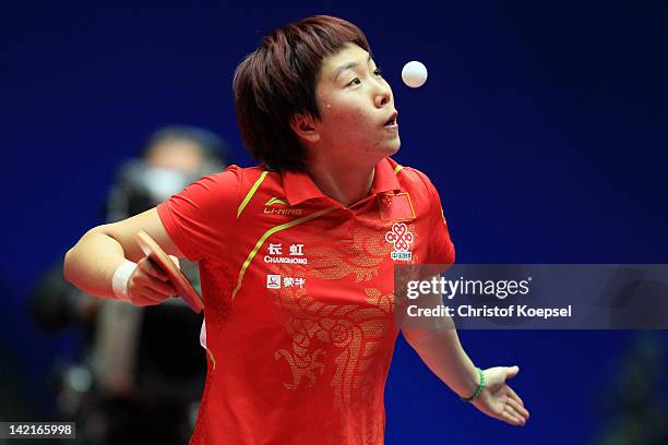 Li Xiaoxia of China serves during her match against Tie Yana of Hongkong during the LIEBHERR table tennis team world cup 2012 championship division...