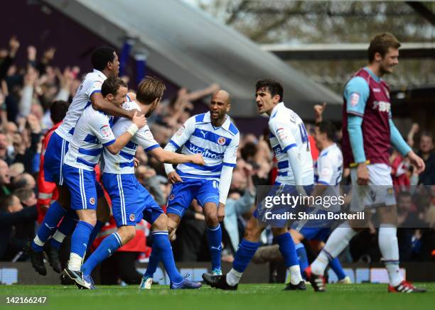Kaspars Gorkss of Reading celebrates with team-mates after scoring during the npower Championship match between West Ham United and Reading at Boleyn...
