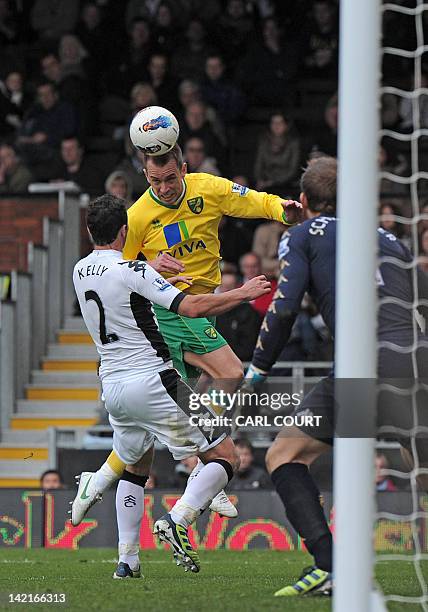 Norwich City's English striker Aaron Wilbraham heads the ball at goal during the English Premier League football match between Fulham and Norwich...