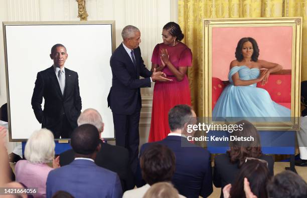 Former U.S. President Barack Obama and former first lady Michelle Obama unveil their official White House portraits during a ceremony at the White...