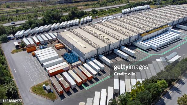 distribution logistics building parking lot - aerial view - overhead power line stock pictures, royalty-free photos & images