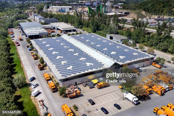 large industrial building, solar panels and trucks - aerial view - innovation hub stock pictures, royalty-free photos & images