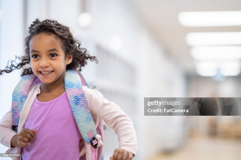 Student Running Through the School Hallway