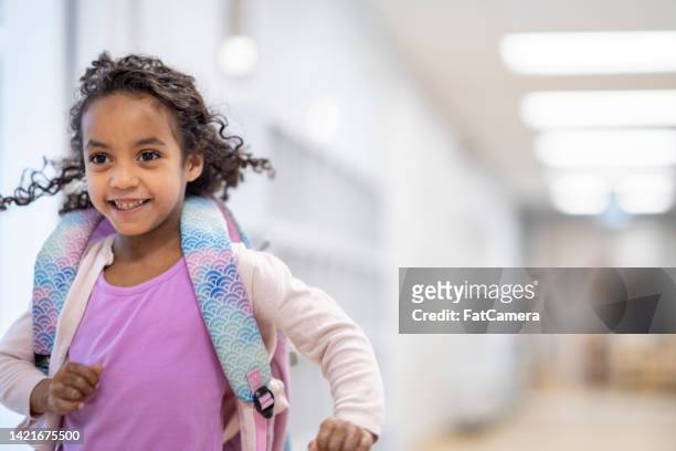 student running through the school hallway - teacher school supplies stock pictures, royalty-free photos & images
