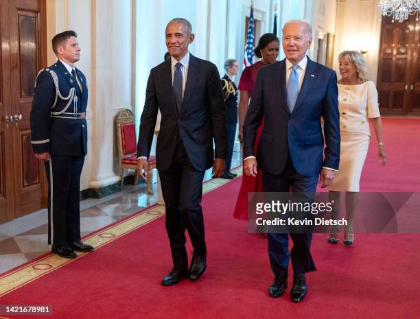 Former U.S. President Barack Obama, former First Lady Michelle Obama, U.S. President Joe Biden and First Lady Jill Biden arrive at a ceremony to...
