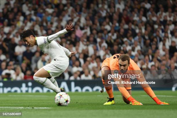 Son Heung-Min of Tottenham Hotspur challenges Pau Lopez of Marseille during the UEFA Champions League group D match between Tottenham Hotspur and...