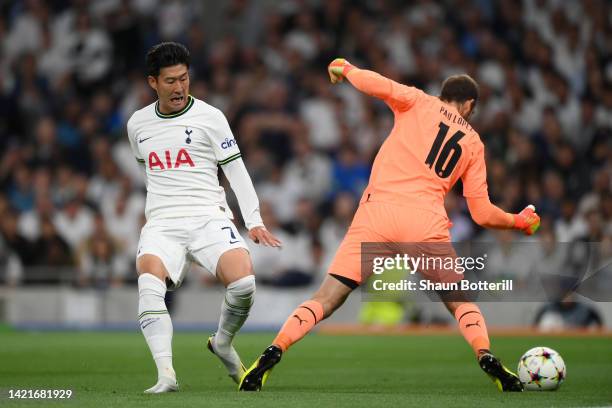 Son Heung-Min of Tottenham Hotspur challenges Pau Lopez of Marseille during the UEFA Champions League group D match between Tottenham Hotspur and...