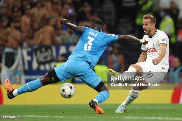 Harry Kane of Tottenham Hotspur shoots under pressure from Eric Bailly of Marseille during the UEFA Champions League group D match between Tottenham...