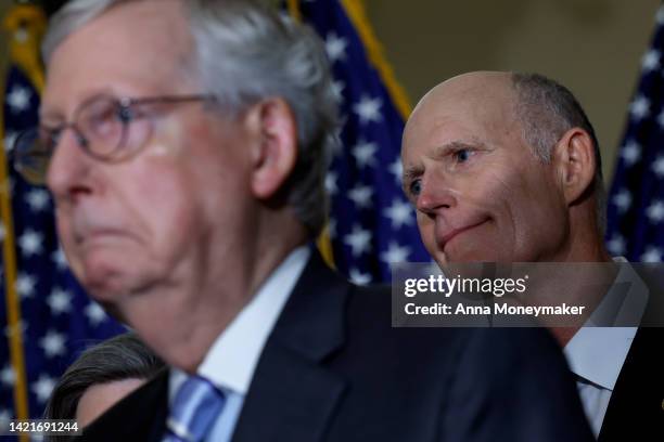 Sen. Rick Scott and Senate Minority Leader Mitch McConnell listen during a news conference after a policy luncheon with Senate Republicans at the...