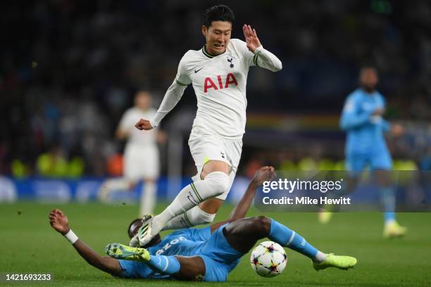 Son Heung-Min of Tottenham Hotspur is tackled by Chancel Mbemba of Marseille leading to a red card for Chancel Mbemba during the UEFA Champions...