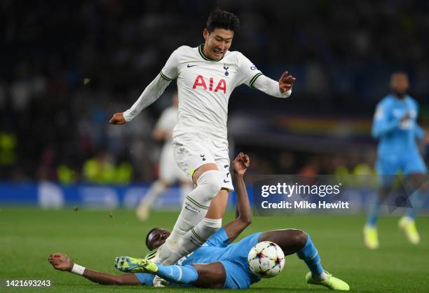 Son Heung-Min of Tottenham Hotspur is tackled by Chancel Mbemba of Marseille leading to a red card for Chancel Mbemba during the UEFA Champions...