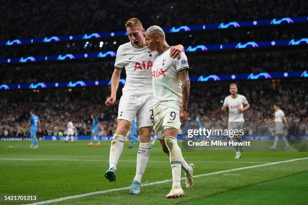 Richarlison of Tottenham Hotspur celebrates with teammate Dejan Kulusevski after scoring their team's second goal during the UEFA Champions League...