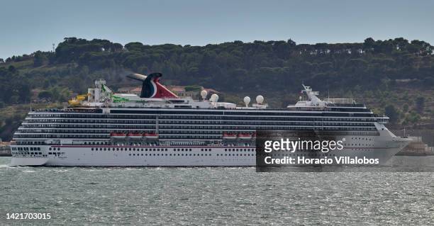 Carnival Pride, a Spirit-class cruise ship operated by Carnival Cruise Line, sails the Tagus River after leaving the Cruises Terminal on September...