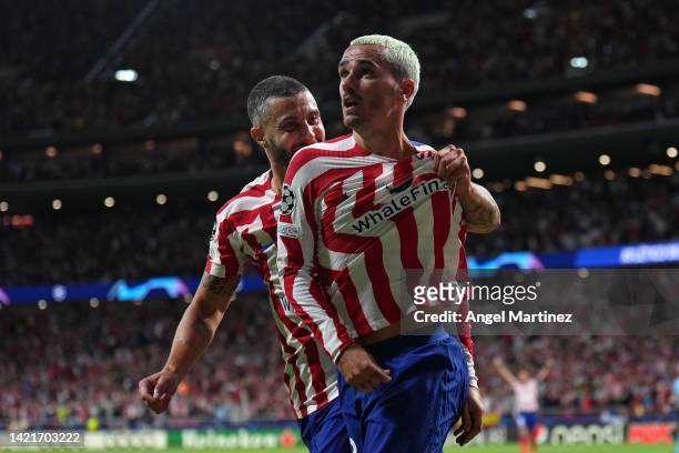 Antoine Griezmann of Atletico de Madrid celebrates with teammate Mario Hermoso after scoring their team's second goal during the UEFA Champions...