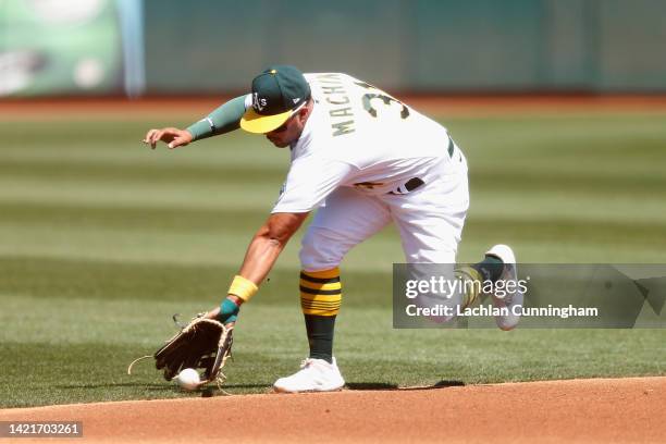 Vimael Machin of the Oakland Athletics fields a ball at third base hit by Travis d'Arnaud of the Atlanta Braves in the top of the second inning at...