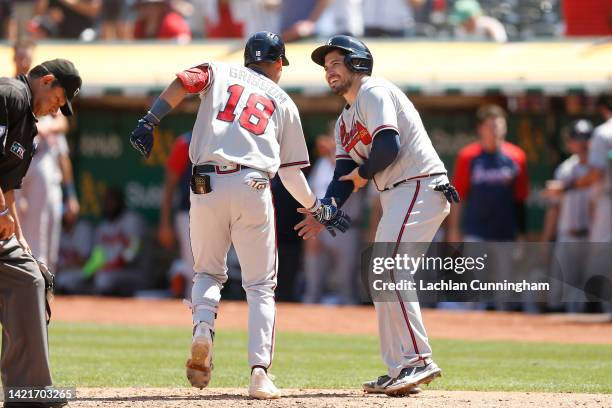 Vaughn Grissom of the Atlanta Braves celebrates with Travis d'Arnaud after hitting a two-run home run in the top of the fifth inning against the...
