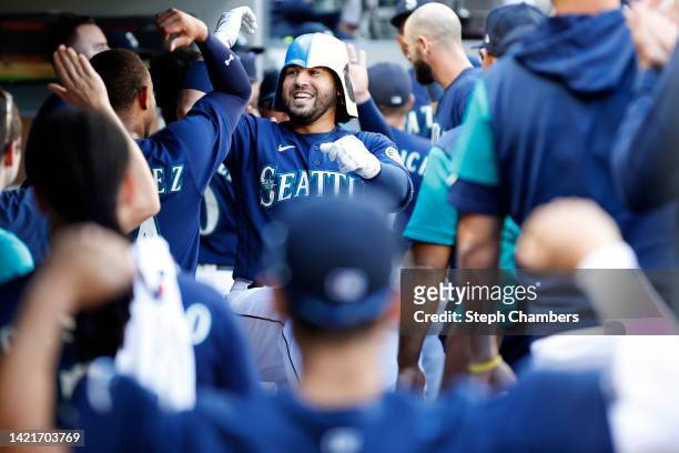 Eugenio Suarez of the Seattle Mariners reacts after his two-run home run for his 1000th career hit during the third inning against the Chicago White...