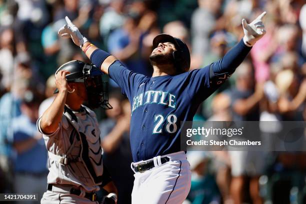 Eugenio Suarez of the Seattle Mariners reacts after his two-run home run for his 1000th career hit during the third inning against the Chicago White...