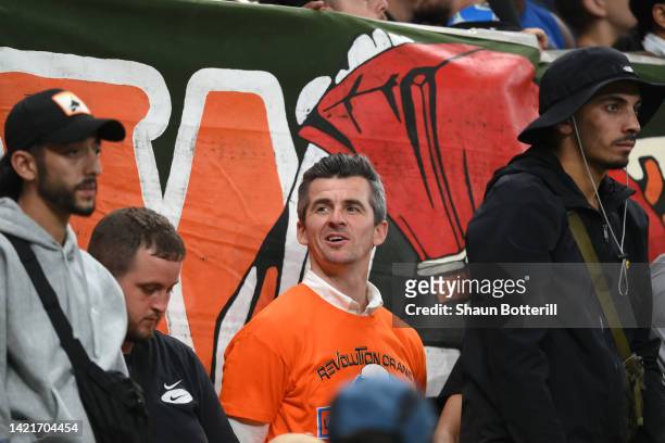 Former Olympique Marseille player and current Bristol Rovers manager, Joey Barton looks on from the crowd during the UEFA Champions League group D...