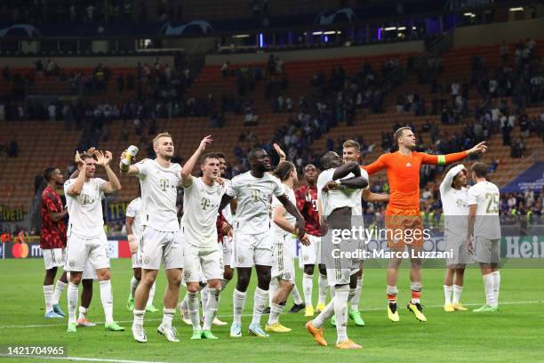 Bayern Munich players celebrate to the fans following their side's victory in the UEFA Champions League group C match between FC Internazionale and...