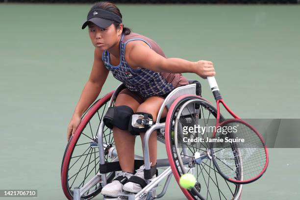 Yui Kamiji of Japan returns a shot against Macarena Cabrillana of Chile during their Women’s Wheelchair Singles First Round match on Day Ten of the...
