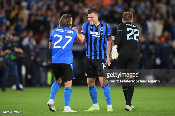 Bjorn Meijer , Casper Nielsen and Simon Mignolet of Club Brugge celebrate victory following the UEFA Champions League group B match between Club...