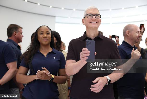 Apple CEO Tim Cook holds a new iPhone 14 Pro during an Apple special event on September 07, 2022 in Cupertino, California. Apple unveiled the new...