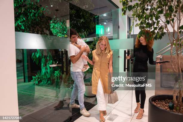 family entering the restaurant - dinner open cafe stock pictures, royalty-free photos & images