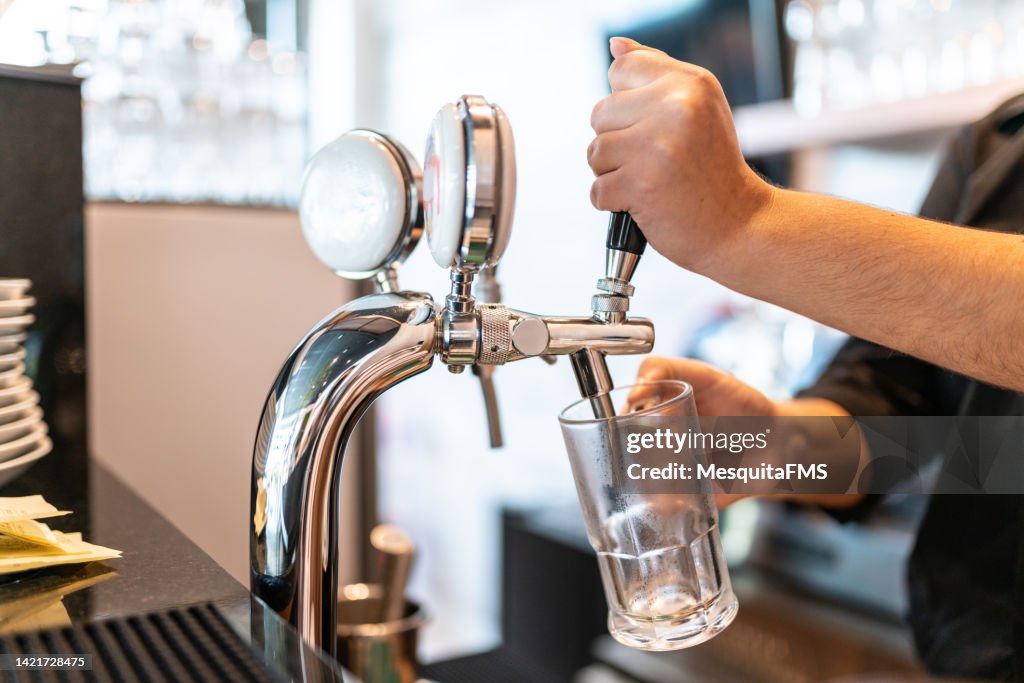 Bartender serving beer
