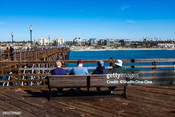 sitting at the pier - oceanside pier stock pictures, royalty-free photos & images