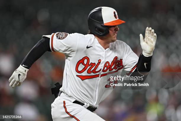 Adley Rutschman of the Baltimore Orioles runs to first base before being called out against the Toronto Blue Jays during the third inning at Oriole...