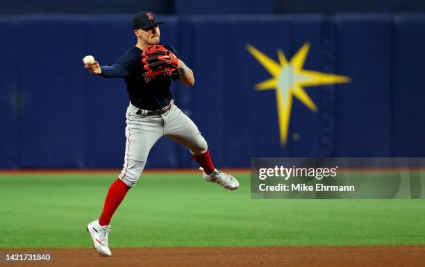 Enrique Hernandez of the Boston Red Sox makes a throw to first during a game against the Tampa Bay Rays at Tropicana Field on September 07, 2022 in...