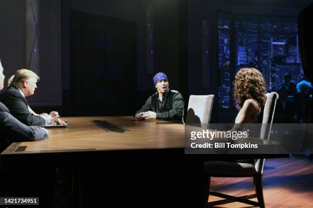 Donald Trump interacts with Bret Michaels and Holly Robinson Peete during the Celebrity Apprentice livre season finale on May 16, 2010 in New York...