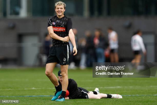 Jack Ginnivan of the Magpies wrestles with John Noble of the Magpies during a Collingwood Magpies AFL training session at Olympic Park on September...